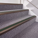 Dark Bronze double insert chevron stair nosing, 40mm riser with Dark Green inserts, fitted on carpeted stairs