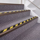 Dark Bronze double insert chevron stair nosing, 40mm riser with Hazard black and yellow inserts, fitted on carpeted stairs