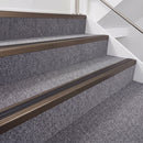 Dark Bronze double insert chevron stair nosing, 40mm riser with Premium Black inserts, fitted on carpeted stairs