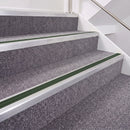 Mill Finish double insert chevron stair nosing, 40mm riser with Dark Green inserts, fitted on carpeted stairs