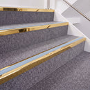 Mirrorflect Gold double insert chevron stair nosing, 40mm riser with Aura inserts, fitted on carpeted stairs