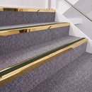 Mirrorflect Gold double insert chevron stair nosing, 40mm riser with Dark Green inserts, fitted on carpeted stairs