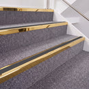 Mirrorflect Gold double insert chevron stair nosing, 40mm riser with Dark Grey inserts, fitted on carpeted stairs