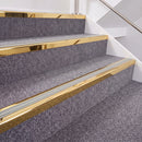 Mirrorflect Gold double insert chevron stair nosing, 40mm riser with Oyster inserts, fitted on carpeted stairs