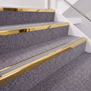 Mirrorflect Gold double insert chevron stair nosing, 40mm riser with Polar Grey inserts, fitted on carpeted stairs