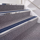 Mirrorflect Silver double insert chevron stair nosing, 40mm riser with Dark Blue inserts, fitted on carpeted stairs