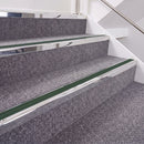 Mirrorflect Silver double insert chevron stair nosing, 40mm riser with Dark Green inserts, fitted on carpeted stairs