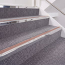 Mirrorflect Silver double insert chevron stair nosing, 40mm riser with Mid Brown inserts, fitted on carpeted stairs