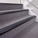 Satin Black double insert chevron stair nosing, 40mm riser with Blue inserts, fitted on carpeted stairs