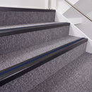 Satin Black double insert chevron stair nosing, 40mm riser with Dark Blue inserts, fitted on carpeted stairs