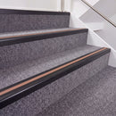 Satin Black double insert chevron stair nosing, 40mm riser with Mid Brown inserts, fitted on carpeted stairs