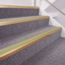 Satin Bronze double insert chevron stair nosing, 40mm riser with Apple Green inserts, fitted on carpeted stairs