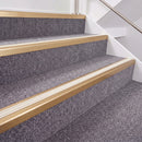 Satin Bronze double insert chevron stair nosing, 40mm riser with White inserts, fitted on carpeted stairs