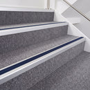 Satin Silver double insert chevron stair nosing, 40mm riser with Dark Blue inserts, fitted on carpeted stairs