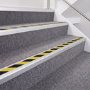 Satin Silver double insert chevron stair nosing, 40mm riser with Hazard black and yellow inserts, fitted on carpeted stairs