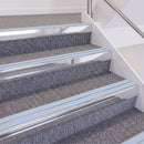 Bright Polished double insert chevron stair nosing, 60mm riser with Aura inserts, fitted on carpeted stairs