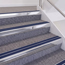 Bright Polished double insert chevron stair nosing, 60mm riser with Dark Blue inserts, fitted on carpeted stairs