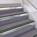 Bright Polished double insert chevron stair nosing, 60mm riser with Dark Green inserts, fitted on carpeted stairs