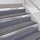 Bright Polished double insert chevron stair nosing, 60mm riser with Dark Grey inserts, fitted on carpeted stairs