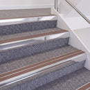 Bright Polished double insert chevron stair nosing, 60mm riser with Mid Brown inserts, fitted on carpeted stairs