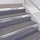Bright Polished double insert chevron stair nosing, 60mm riser with Mid Grey inserts, fitted on carpeted stairs