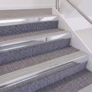 Bright Polished double insert chevron stair nosing, 60mm riser with Oyster inserts, fitted on carpeted stairs