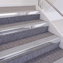 Bright Polished double insert chevron stair nosing, 60mm riser with Polar Grey inserts, fitted on carpeted stairs
