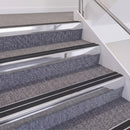 Bright Polished double insert chevron stair nosing, 60mm riser with Premium Black inserts, fitted on carpeted stairs