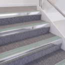 Bright Polished double insert chevron stair nosing, 60mm riser with Sage Green inserts, fitted on carpeted stairs