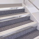 Bright Polished double insert chevron stair nosing, 60mm riser with White inserts, fitted on carpeted stairs