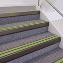 Dark Bronze double insert chevron stair nosing, 60mm riser with Apple Green inserts, fitted on carpeted stairs