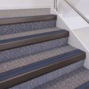 Dark Bronze double insert chevron stair nosing, 60mm riser with Blue inserts, fitted on carpeted stairs