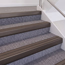 Dark Bronze double insert chevron stair nosing, 60mm riser with Brown inserts, fitted on carpeted stairs