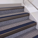 Dark Bronze double insert chevron stair nosing, 60mm riser with Dark Blue inserts, fitted on carpeted stairs