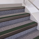 Dark Bronze double insert chevron stair nosing, 60mm riser with Dark Green inserts, fitted on carpeted stairs