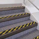 Dark Bronze double insert chevron stair nosing, 60mm riser with Hazard black and yellow inserts, fitted on carpeted stairs