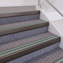 Dark Bronze double insert chevron stair nosing, 60mm riser with Sage Green inserts, fitted on carpeted stairs