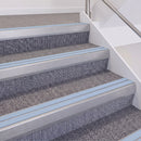 Mill Finish double insert chevron stair nosing, 60mm riser with Aura inserts, fitted on carpeted stairs