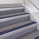 Mill Finish double insert chevron stair nosing, 60mm riser with Dark Blue inserts, fitted on carpeted stairs