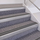 Mill Finish double insert chevron stair nosing, 60mm riser with Dark Grey inserts, fitted on carpeted stairs