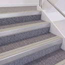 Mill Finish double insert chevron stair nosing, 60mm riser with Oyster inserts, fitted on carpeted stairs