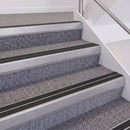 Mill Finish double insert chevron stair nosing, 60mm riser with Premium Black inserts, fitted on carpeted stairs