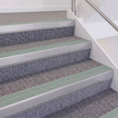 Mill Finish double insert chevron stair nosing, 60mm riser with Sage Green inserts, fitted on carpeted stairs