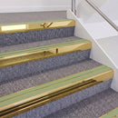 Mirrorflect Gold double insert chevron stair nosing, 60mm riser with Apple Green inserts, fitted on carpeted stairs