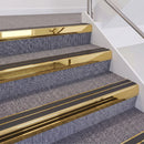 Mirrorflect Gold double insert chevron stair nosing, 60mm riser with Dark Grey inserts, fitted on carpeted stairs