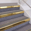 Mirrorflect Gold double insert chevron stair nosing, 60mm riser with Mid Grey inserts, fitted on carpeted stairs