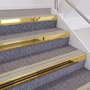 Mirrorflect Gold double insert chevron stair nosing, 60mm riser with Oyster inserts, fitted on carpeted stairs