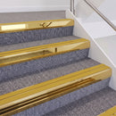 Mirrorflect Gold double insert chevron stair nosing, 60mm riser with Yellow inserts, fitted on carpeted stairs