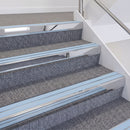 Mirrorflect Silver double insert chevron stair nosing, 60mm riser with Aura inserts, fitted on carpeted stairs
