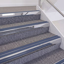 Mirrorflect Silver double insert chevron stair nosing, 60mm riser with Blue inserts, fitted on carpeted stairs
